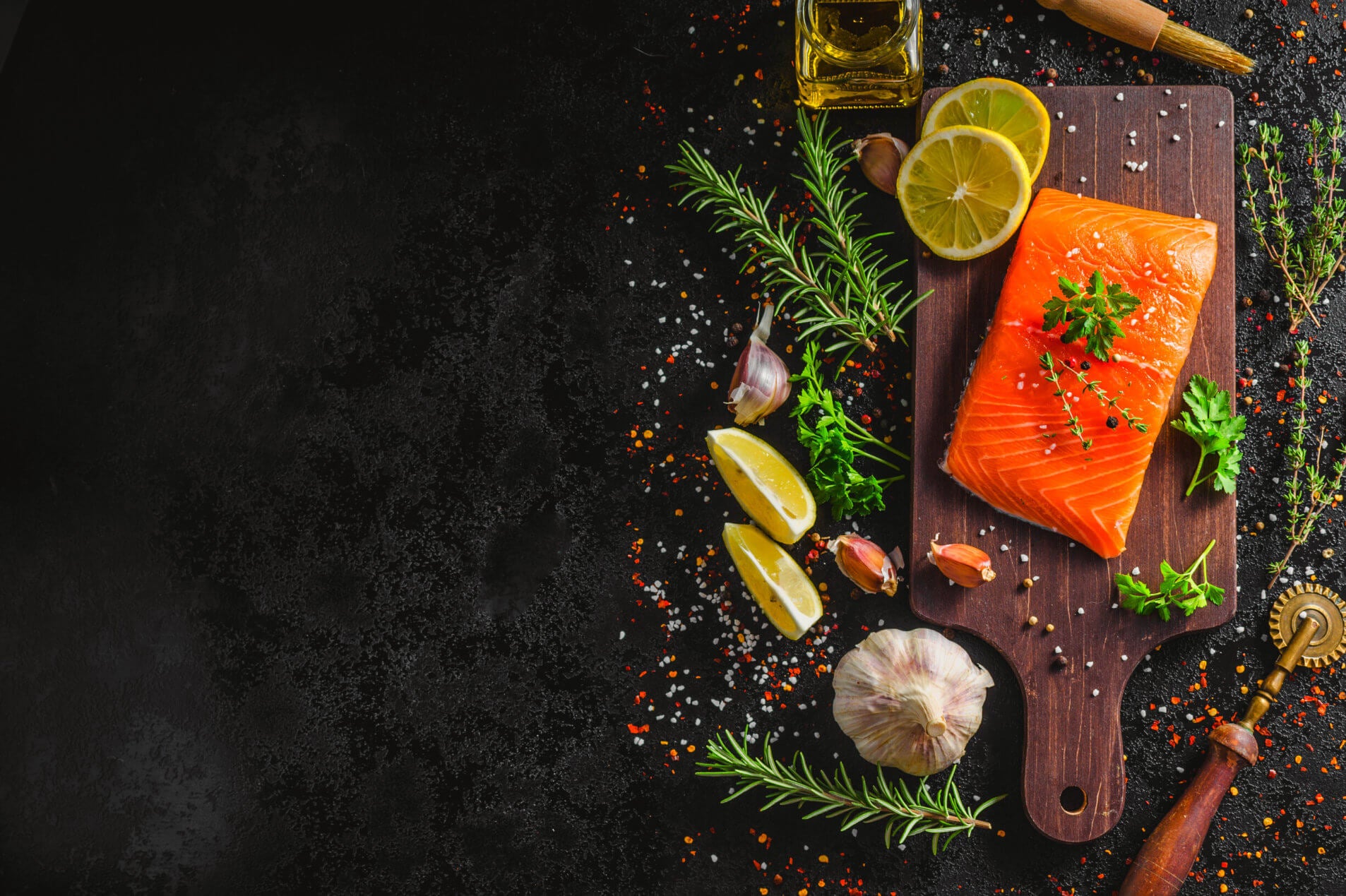 Wild Salmon With Lemon and Herbs served on cutting board.