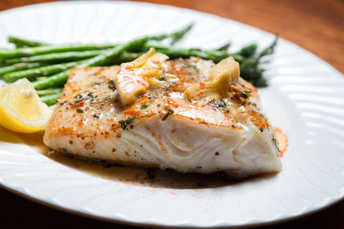 Wild Alaskan Halibut with herb butter, asparagus, and lemon