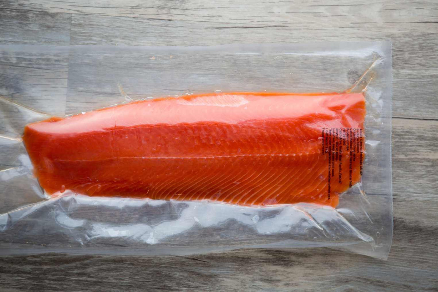 Kwee-Jack Fish Co. vacuum sealed wild caught Alaskan sockeye salmon filet.