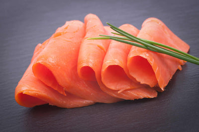 SLICED WILD CAUGHT NOVA SMOKED SALMON WITH CHIVES.